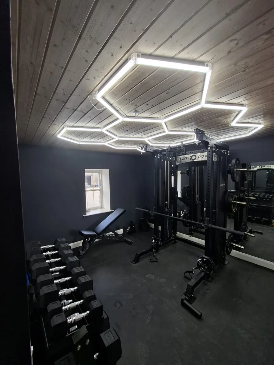 Timber ceiling lining above a home gym space.